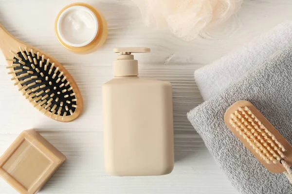 Composition with hair care products on wooden background, top view