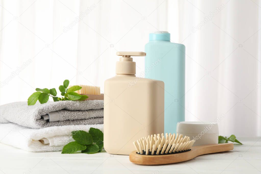 Composition with hair care products on wood table