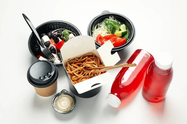 Food delivery. Food in takeaway boxes on white background