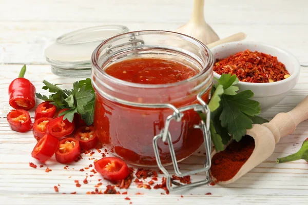 Samenstelling Met Rode Hete Saus Ingrediënten Houten Ondergrond — Stockfoto