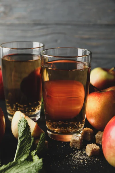 Composition with cider, sugar and apples on wooden background