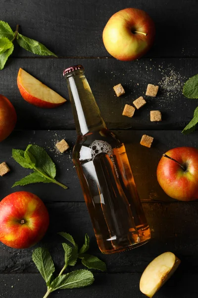 Composition with cider, sugar and apples on wooden background