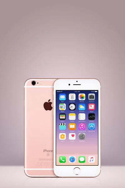 Rose Gold Apple iPhone 7 with iOS 10 on the screen on vertical gradient background with copy space — Stock Photo, Image