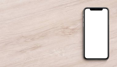 Akıllı telefon iphone X mockup düz yatıyordu üst görünüm kopyalama alanı ile ahşap ofis masası afiş üzerinde yatan benzer