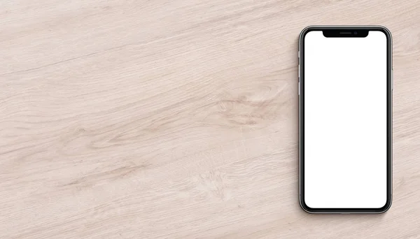 Smartphone similar to iPhone X mockup flat lay top view lying on wooden office desk banner with copy space — Stock Photo, Image