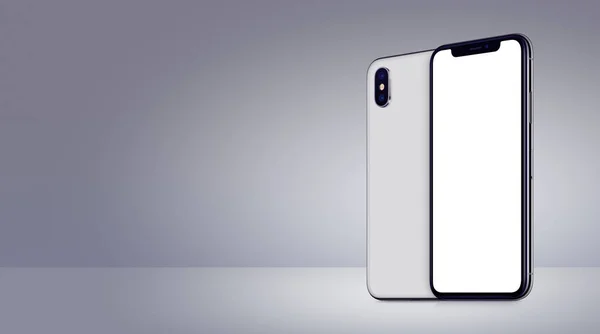 White rotated smartphones mockup similar to iPhone X front and back sides on gray background banner with copy space — Stockfoto