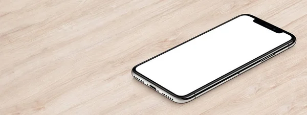 IPhone Xのモックアップに似たアイソメブラックスマートフォンは、コピースペース付きの木製オフィスデスクバナーに横たわっています — ストック写真