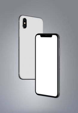 White smartphones similar to iPhone X mockup hovering in the air on gray background