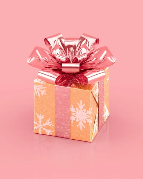 Golden Christmas gift box with sparkling pink bow and ribbons