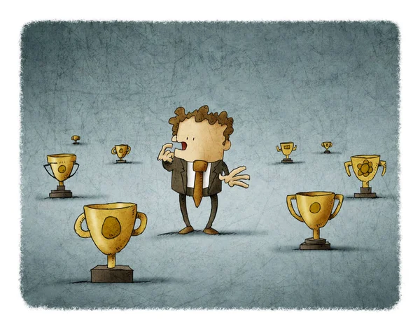 Businessman surrounded by trophies think about which to choose — Stock Photo, Image
