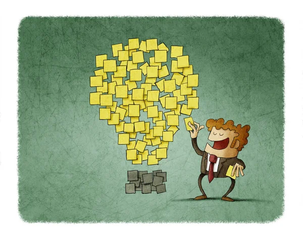 Businessman sticks a post note next to others that are shaped like an idea. creativity concept. — Stock Photo, Image