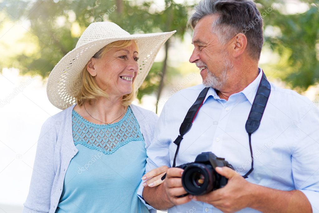 Mature couple with digital camera