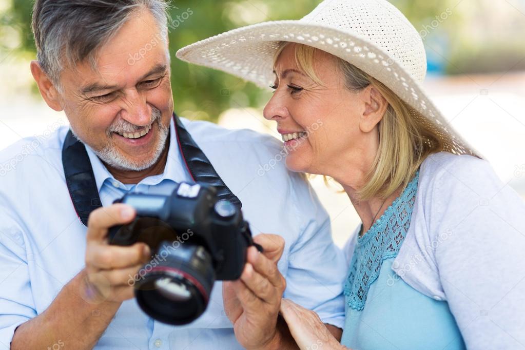 Mature couple with digital camera