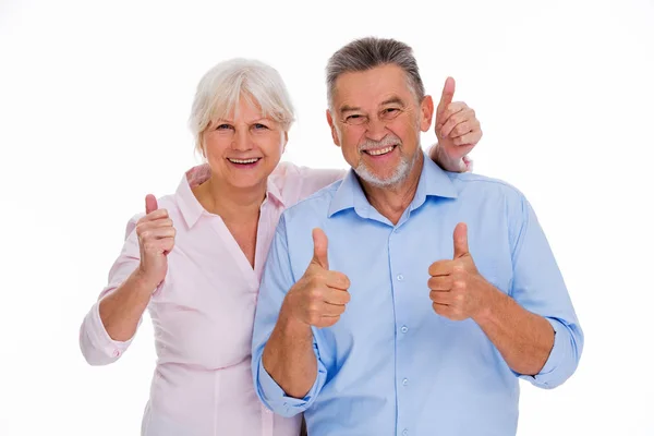 Senior couple showing thumbs up — Stock Photo, Image