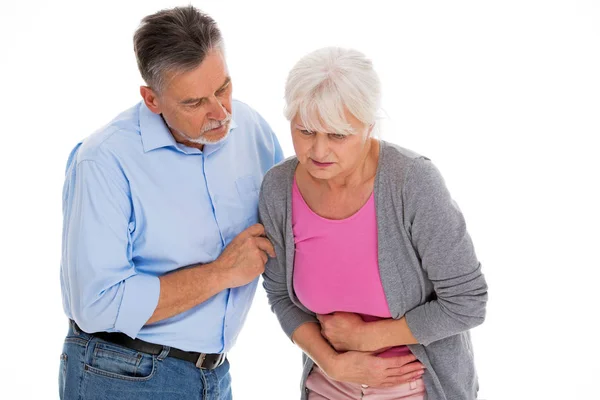 Człowiek pomaga kobieta z bólu żołądka — Zdjęcie stockowe