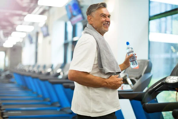 Mature man in health club