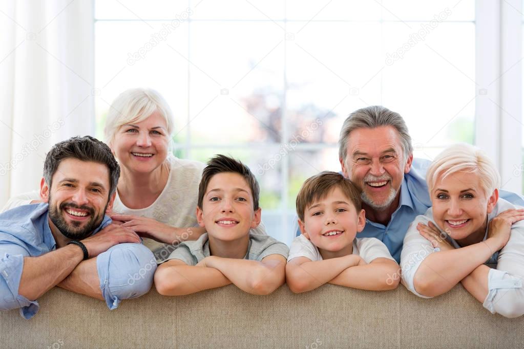 Smiling family on sofa