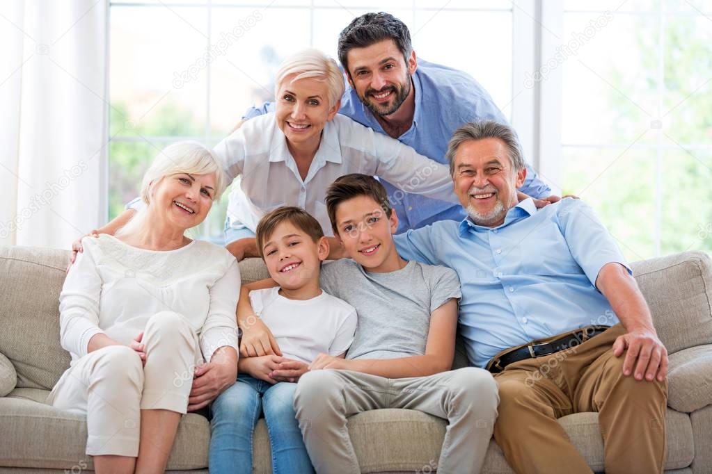 Smiling family on sofa