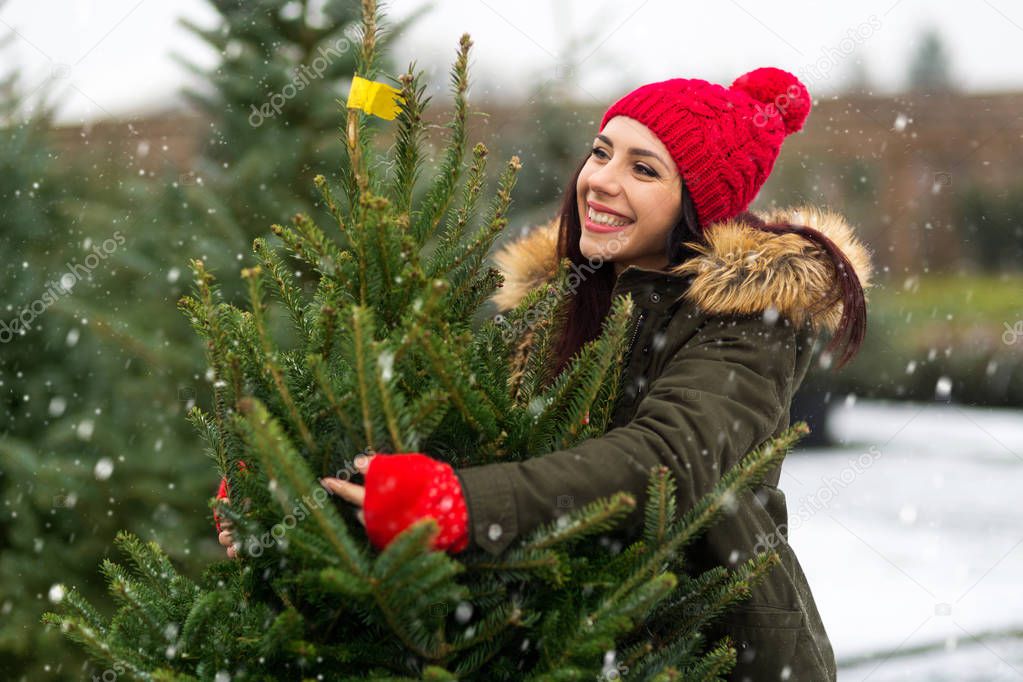 Woman Buying Christmas Tree