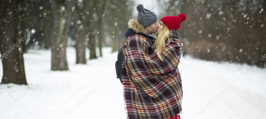 Couple in love in winter scenery
