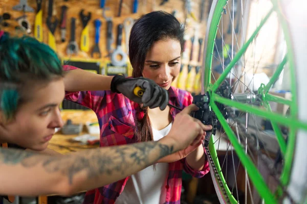 Two Young Women Working Bicycle Repair Shop — Stock Photo, Image