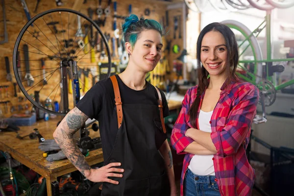 Two Young Women Working Bicycle Repair Shop — Stock Photo, Image