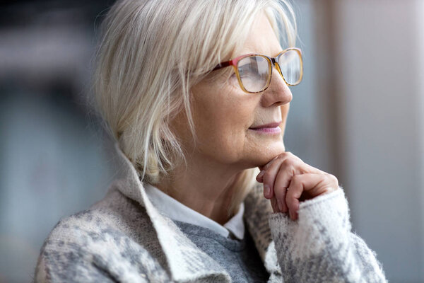 Portrait of senior woman wearing glasses