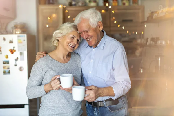 Happy Senior Couple Embracing Home — Stok fotoğraf