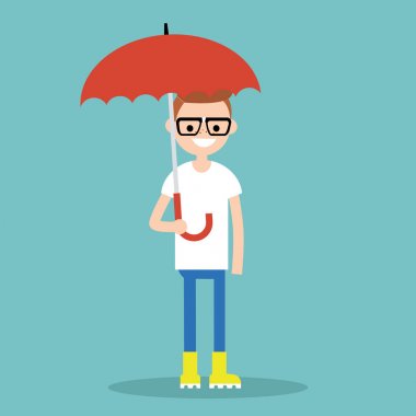 Karakter sarı lastik çizme giyen şemsiye ile gülümseyen genç