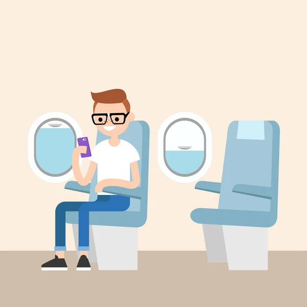 Divertido rojo cabeza nerd sentado en el avión y sosteniendo su inteligente p — Vector de stock