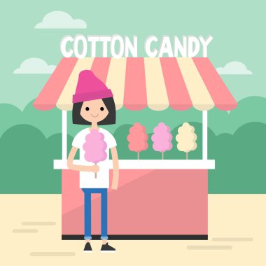 Parkta yürüyüş. Genç kız yemek bir pamuk şeker / düzenlenebilir