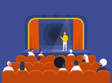 Eğlence ve kültür, stand up komedi şovu, genç erkek sanatçı sahnede performans sergiliyor ve seyirci eski moda iç mimariyle klasik bir tiyatroda oturuyor.
