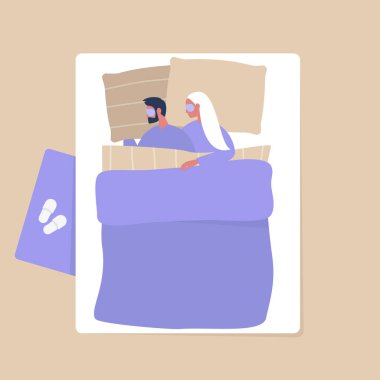 Genç bir çiftin battaniyenin altında sarılıp...