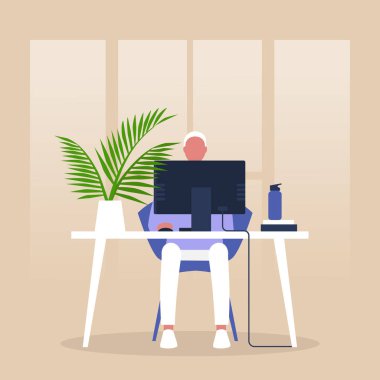 Modern ofis, Monito 'nun önünde oturan genç erkek müdür.