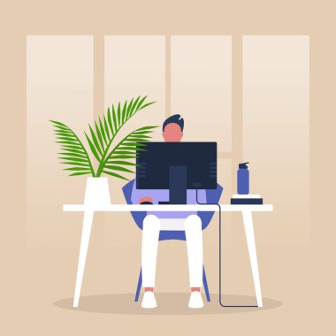 Modern ofis, Monito 'nun önünde oturan genç erkek müdür.