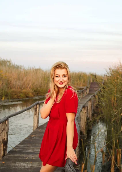 Autumn girl in red dress — Stock Photo, Image