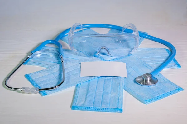 Medical Protective Masks Glasses Stethoscope Blue Wooden Surface Cavid Coronavirus — Stock Photo, Image