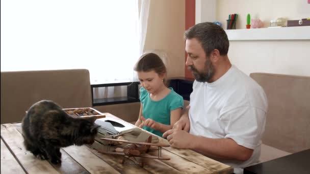 Bearded Father Teaches His Daughter Type Old Typewriter Tortoiseshell Cat — Stock Video