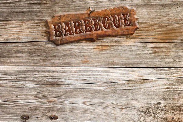 Barbecue signboard nailed to a wooden panel — Stock Photo, Image