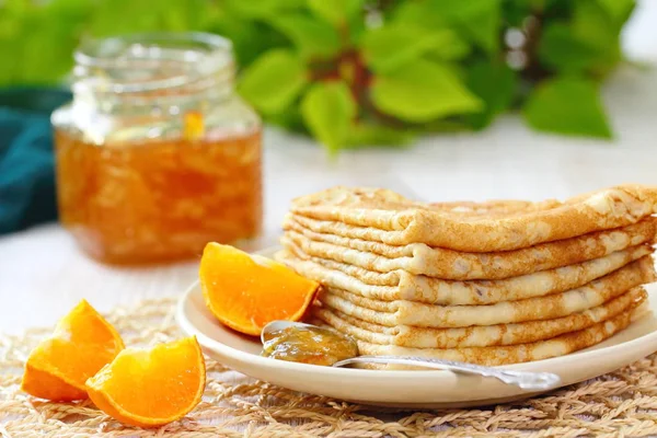 Pancakes with orange jam and fruit — Stock Photo, Image