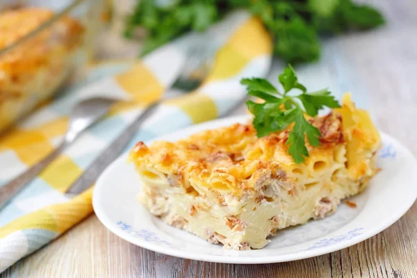 Casserole made of pasta and meat baked with cream and cheese