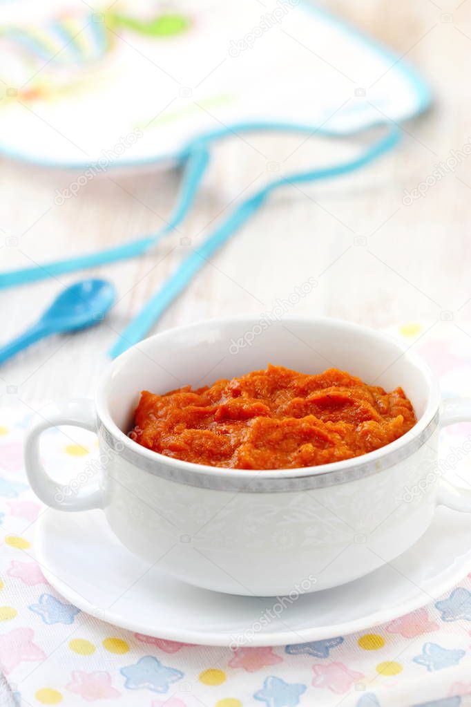 Homemade carrot puree in a white bowl