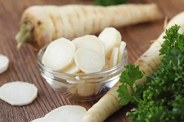 Raw parsley roots for cooking salad