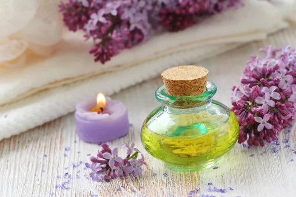 Spa Setting Essential Aroma Oil Lilac Wooden Background — Stock Photo, Image