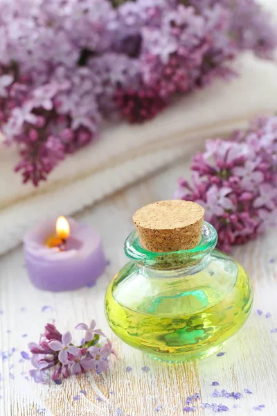 Spa Setting Essential Aroma Oil Lilac Wooden Background — Stock Photo, Image