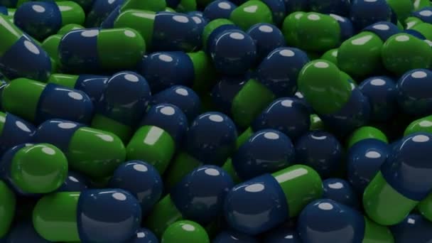 Close Comprimidos Azuis Verdes Farmácia Renderizar Vídeo Cápsulas Distribuídas Aleatoriamente — Vídeo de Stock