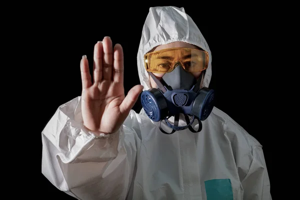 Woman in chemical protective clothing and antigas mask with glas
