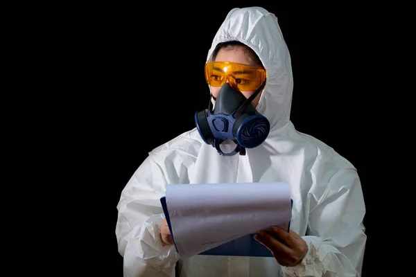 Woman in chemical protective clothing and antigas mask with glas