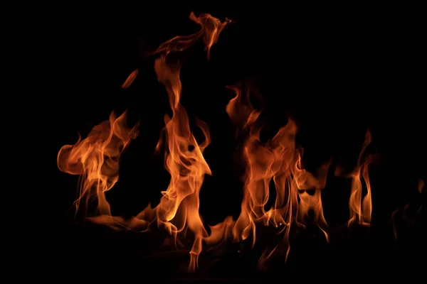 On fire flames at the black background — Stock Photo, Image