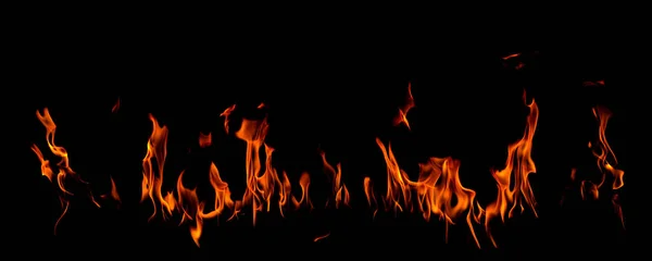 Em chamas de fogo no fundo preto — Fotografia de Stock